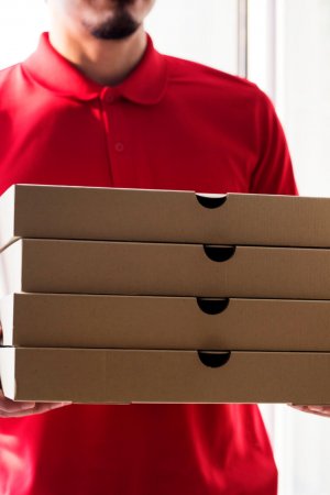 Man delivery pizza to customer